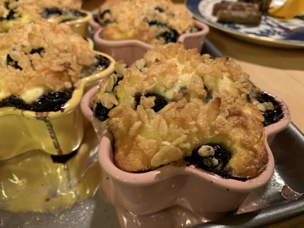Blueberry baked treats with a crispy cereal topping in star-shaped individual dishes.