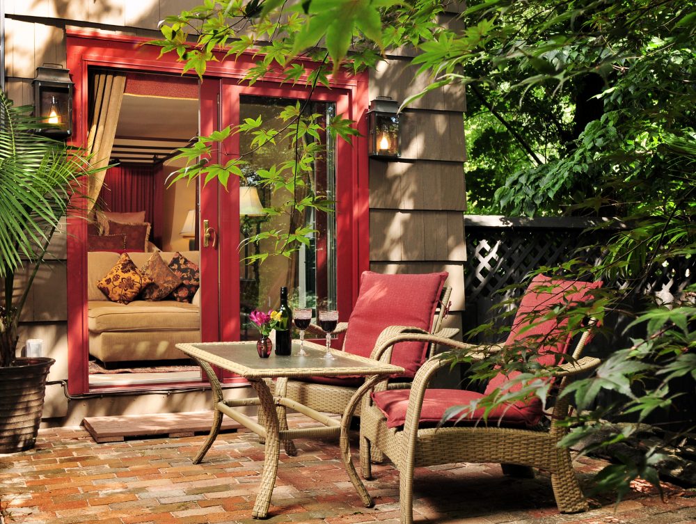 Hotchkiss Room patio with table and chairs for relaxing and wine