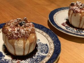 On chilly fall and winter mornings, guests will enjoy our baked apples cooked with granola, maple syrup and cranberry juice. These particular apples were served on blue and white plates