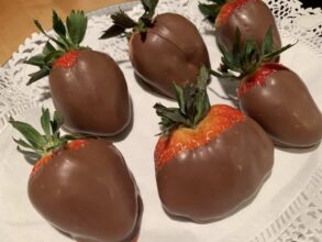 chocolate-covered strawberries on white doiley... available for purchase for your romantic getaway at the 1795 Acorn Inn Bed and Breakfast in the Finger Lakes