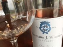 Bottle and glass of Hermann J. Wiemer dry rose wine, located along the Keuka Lake Wine Trail about 40 minutes from the 1795 Acorn Inn Bed and Breakfast