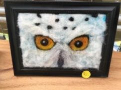 Felt art of bird with yellow eyes... one of the many artistic items for sale at the Lakefront Art Festival in Canandaigua, NY