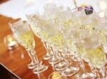 glasses of champagne filled and ready to go for toasting after intimate wedding ceremony at 1795 Acorn Inn Bed and Breakfast in Canandaigua, NY